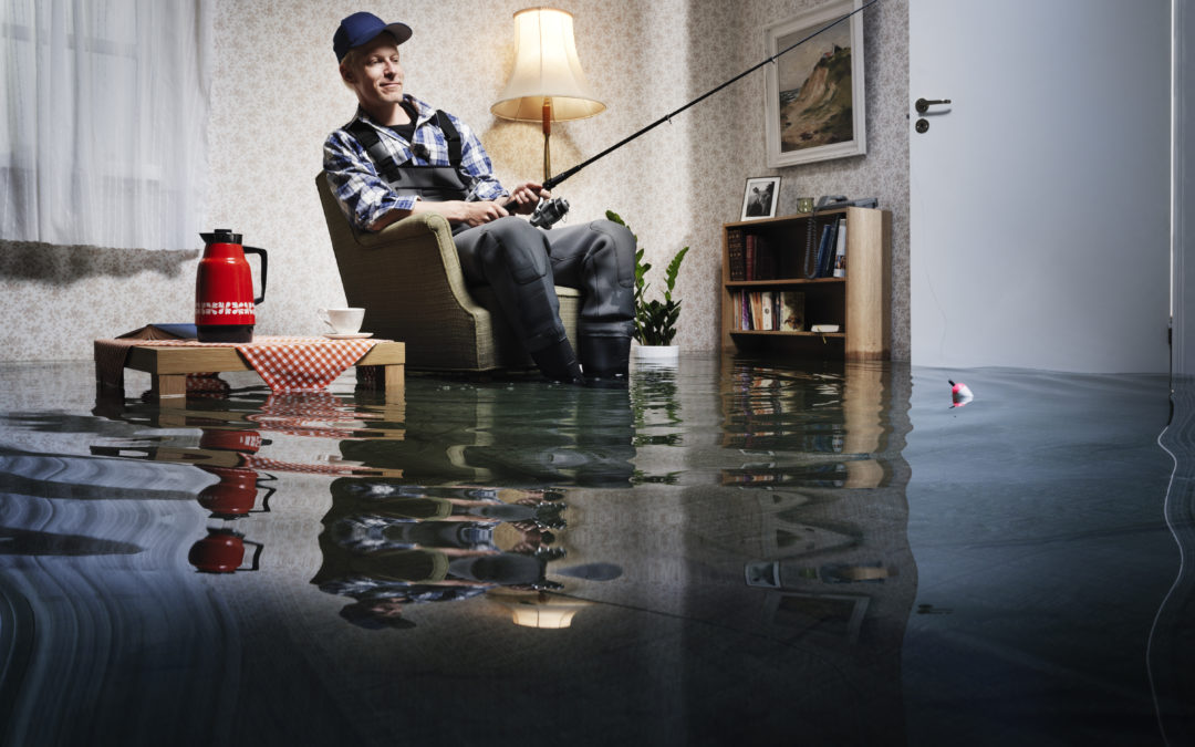 young man fishing in flooded room